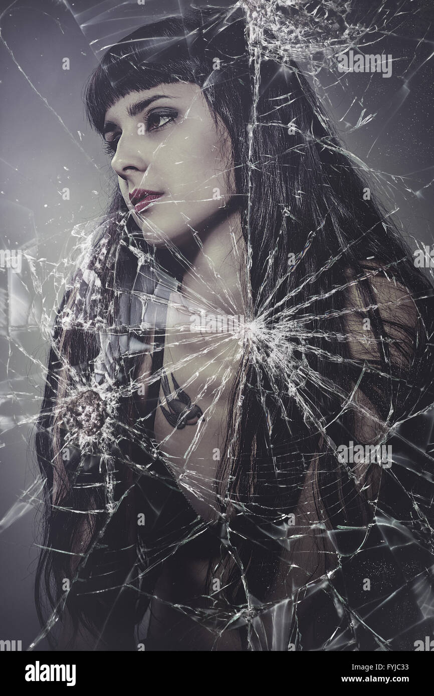 broken glass, beautiful woman with very long hair Stock Photo