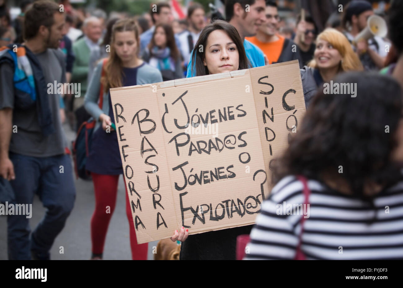 Badajoz, Spain - March 29, 2012: young girl demonstrator with cardboard banner protesting against austerity cuts Stock Photo