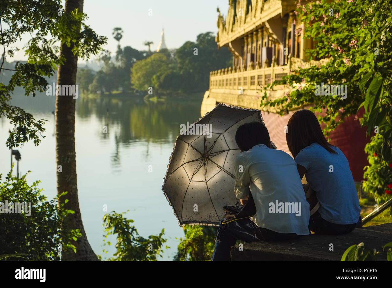 Young couple at Kandawgyi Lake, Yangon, Myanmar Stock Photo