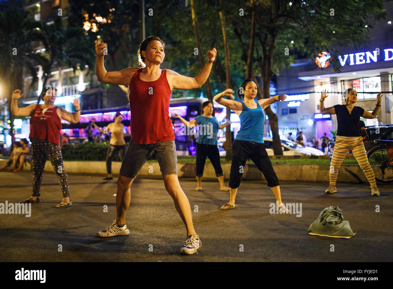 Women practice aerobics exercises at September 23 Park in Ho Chi Minh City, Vietnam Stock Photo