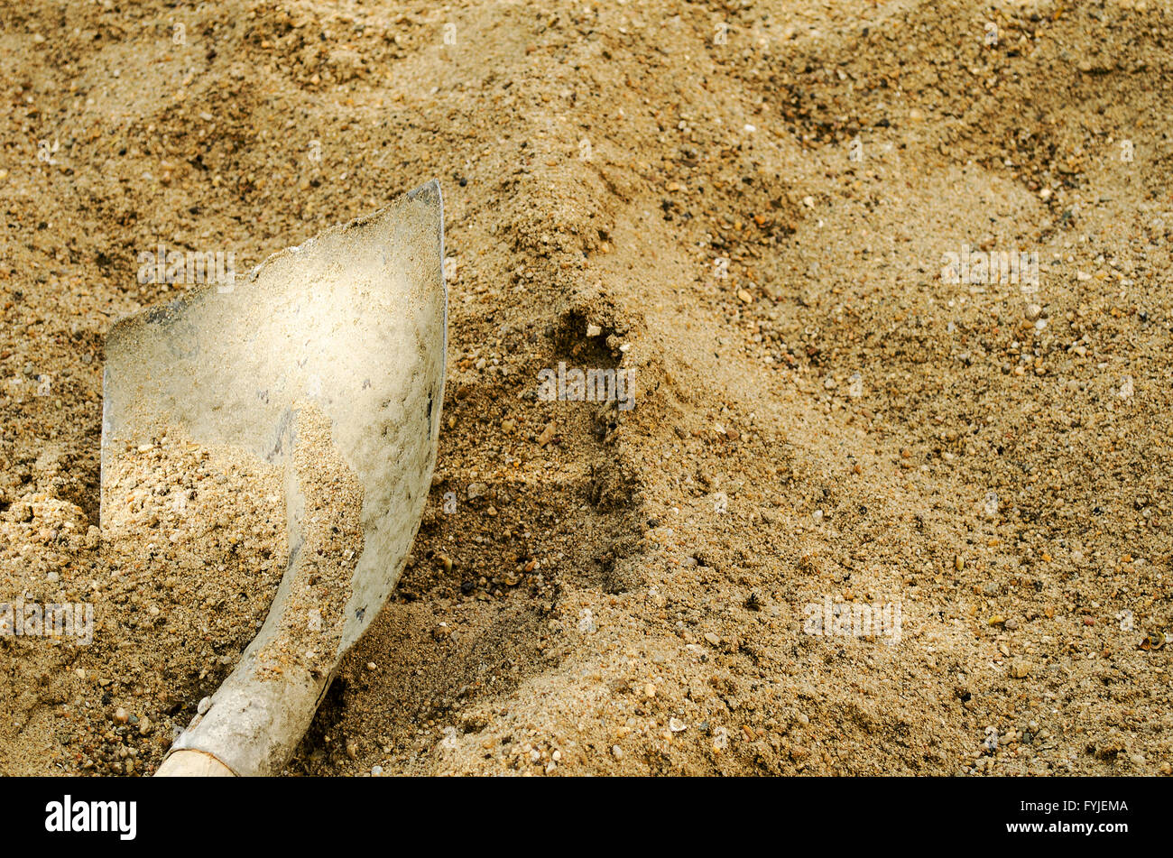 Shovel in a sand Stock Photo Alamy