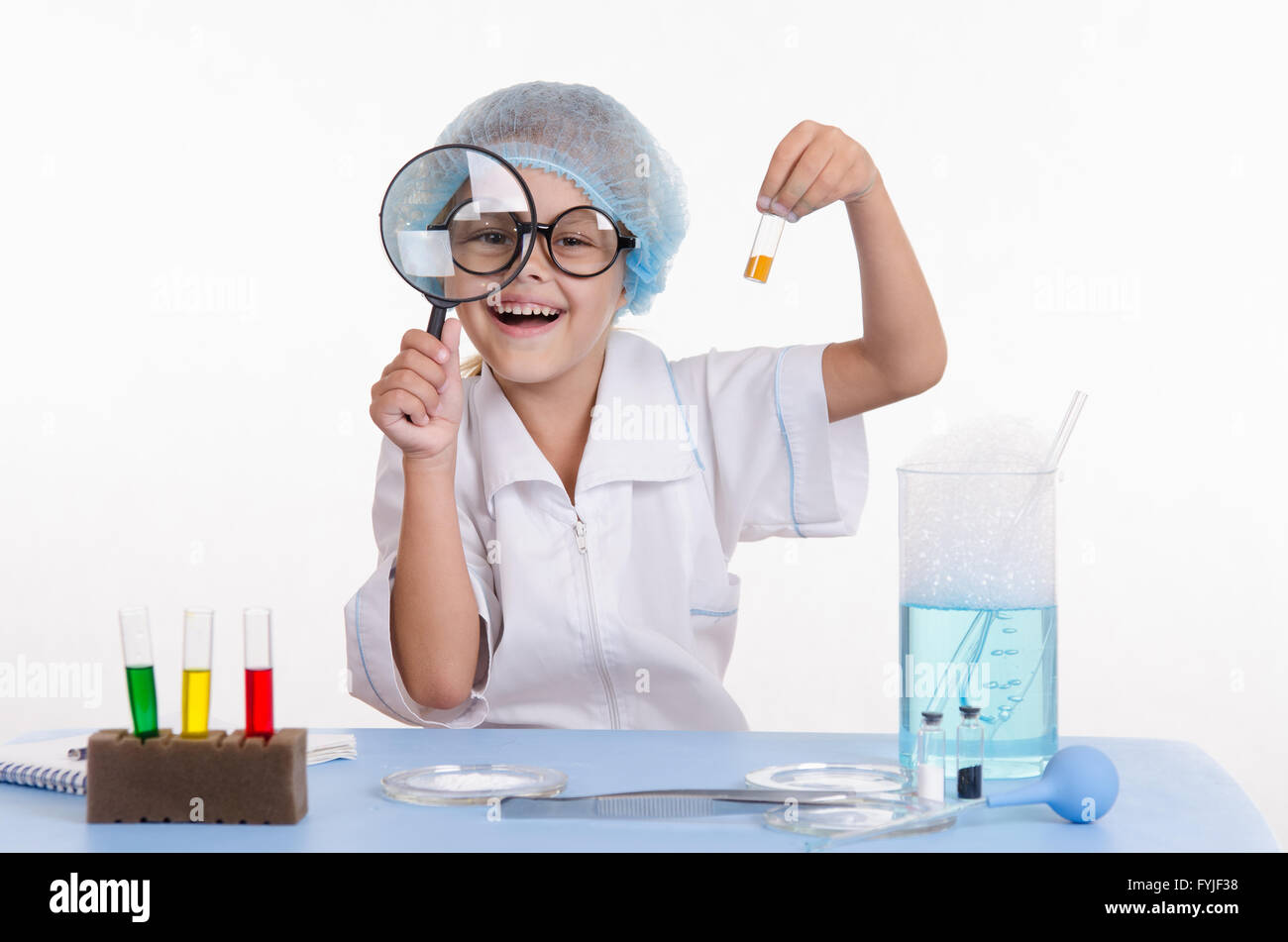 Chemist with the powder and a magnifying glass Stock Photo Alamy