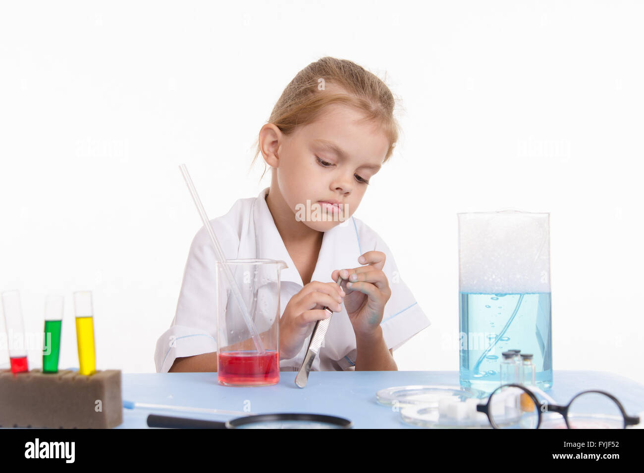 Girl with a pair of tweezers in the laboratory Stock Photo Alamy