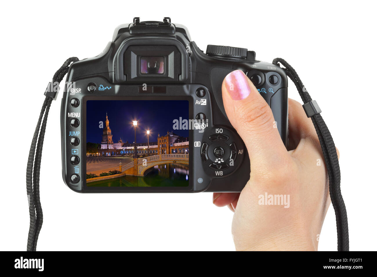 Camera in hand and Sevilla Spain view (my photo) Stock Photo