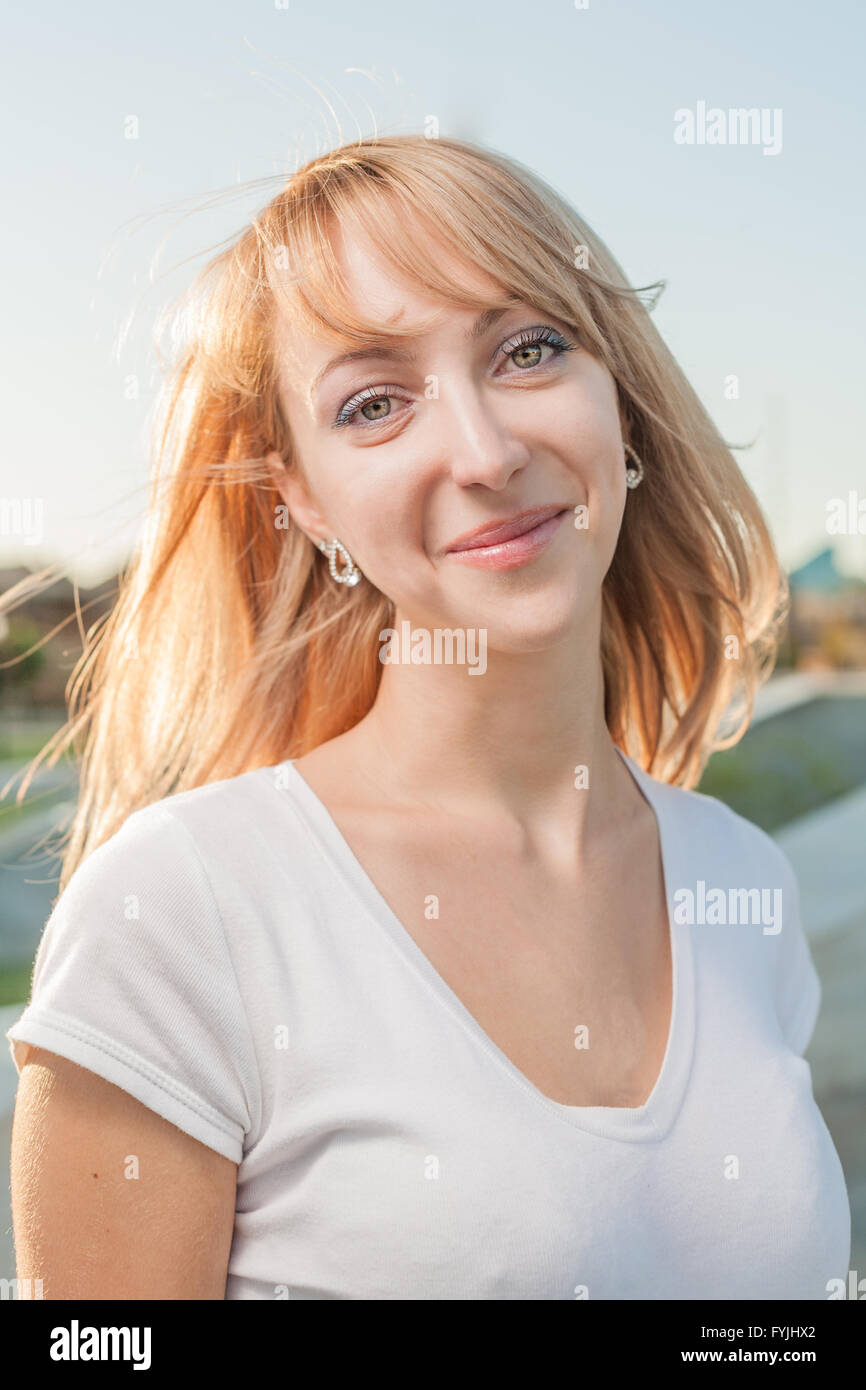 blonde 20s women head and shoulders outdoor against sky Stock Photo