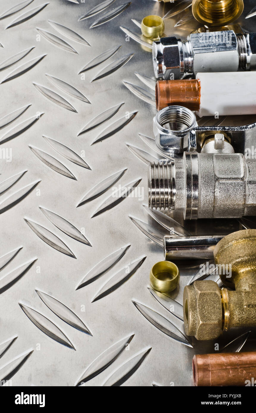 Plumbing inlet pipe valve on a metal surface Stock Photo - Alamy