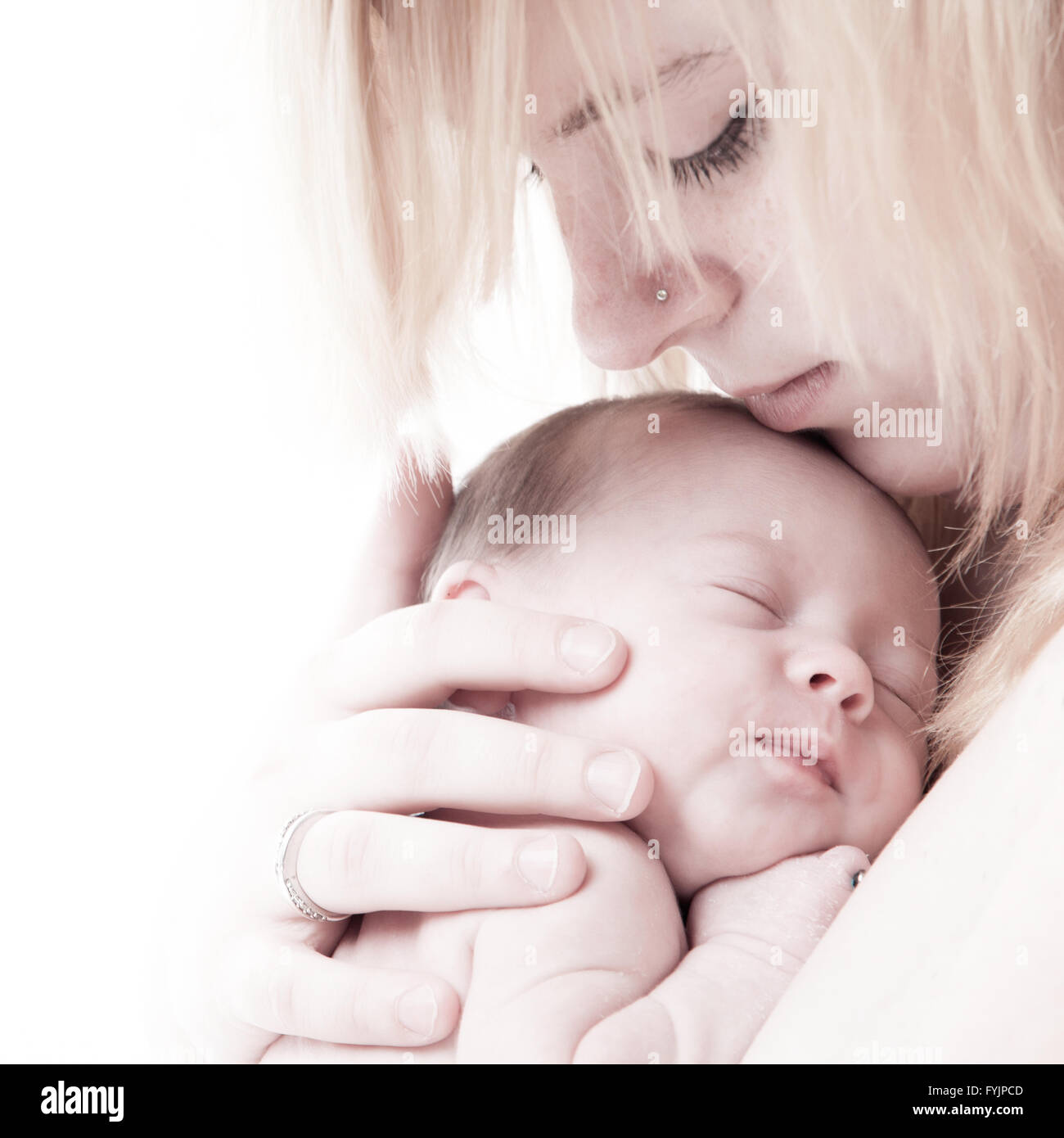 Mothers face and her little child Stock Photo