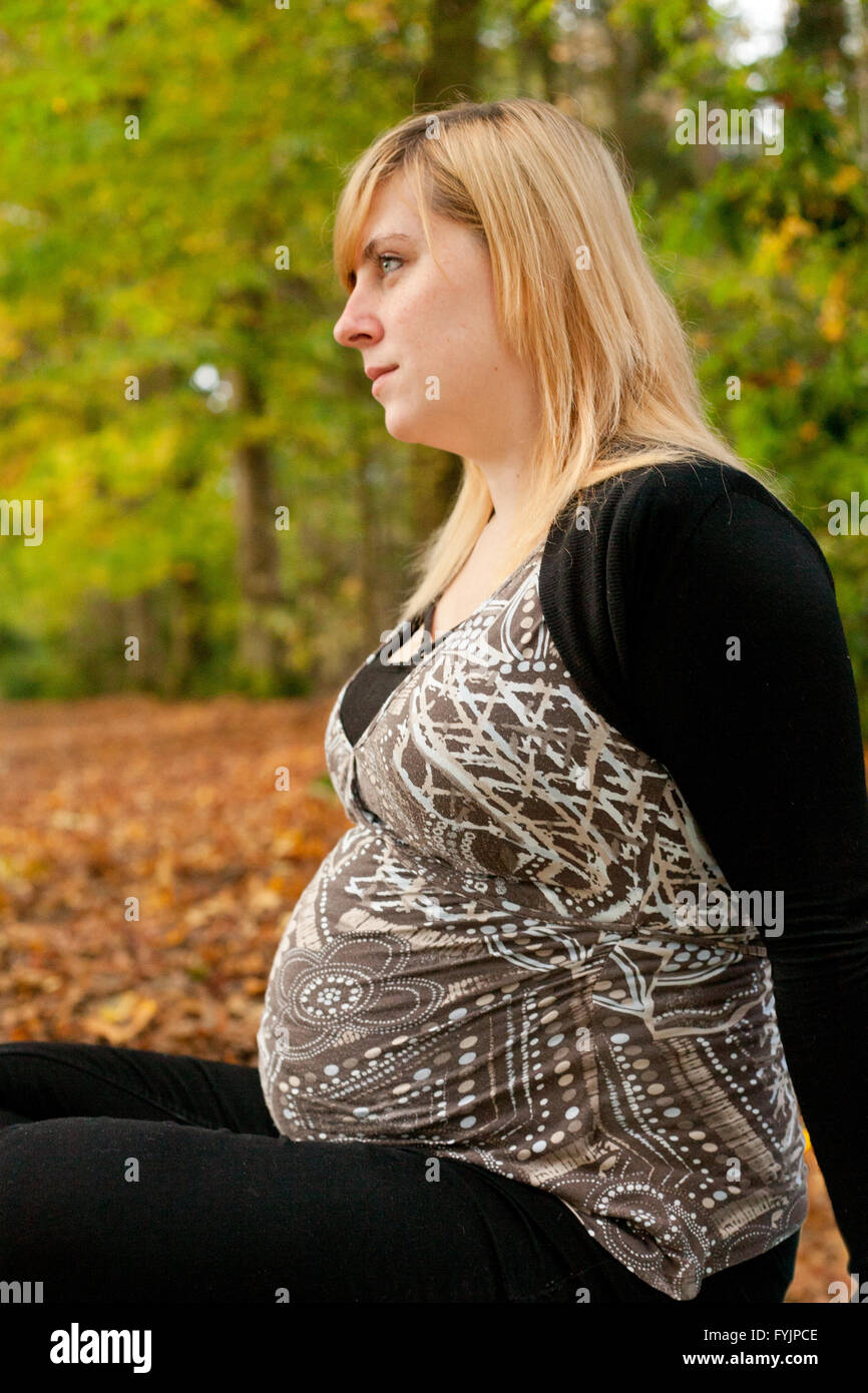 Waiting while pregnant in the fall Stock Photo - Alamy