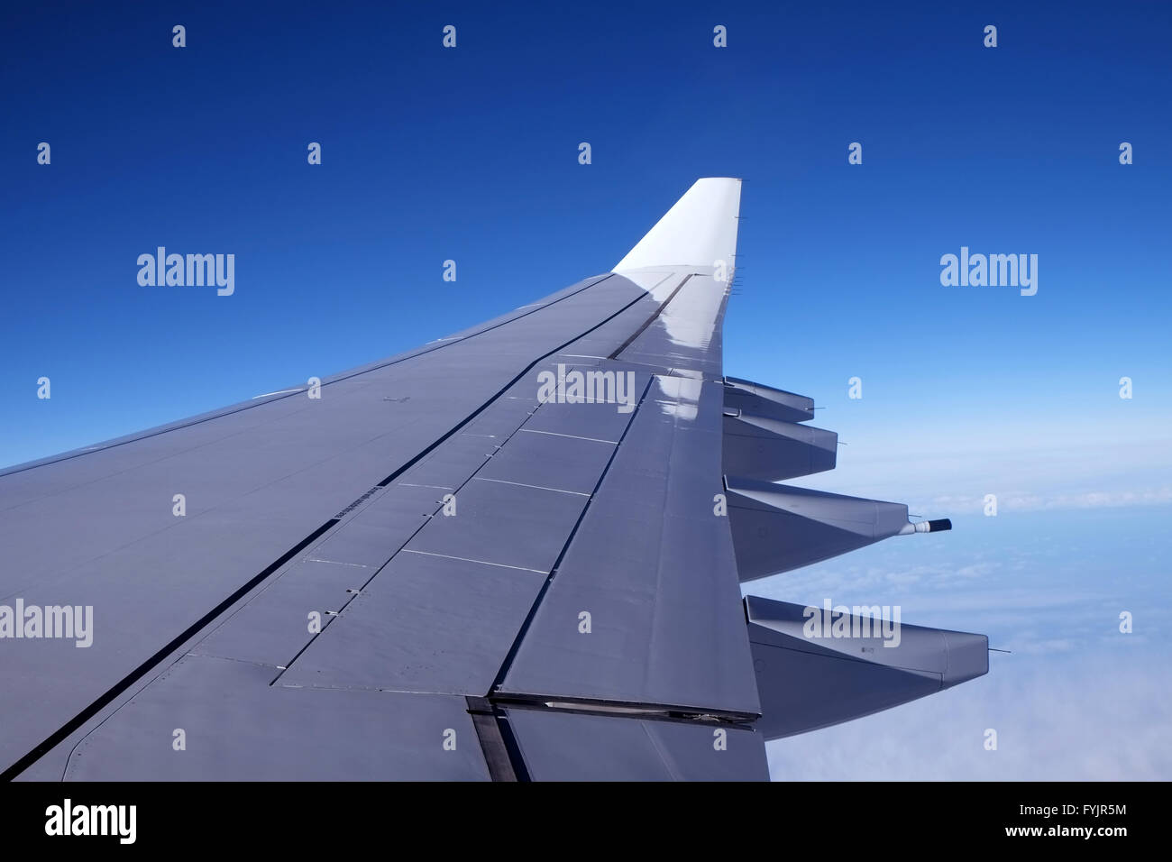 Wing of a passenger airplane Stock Photo