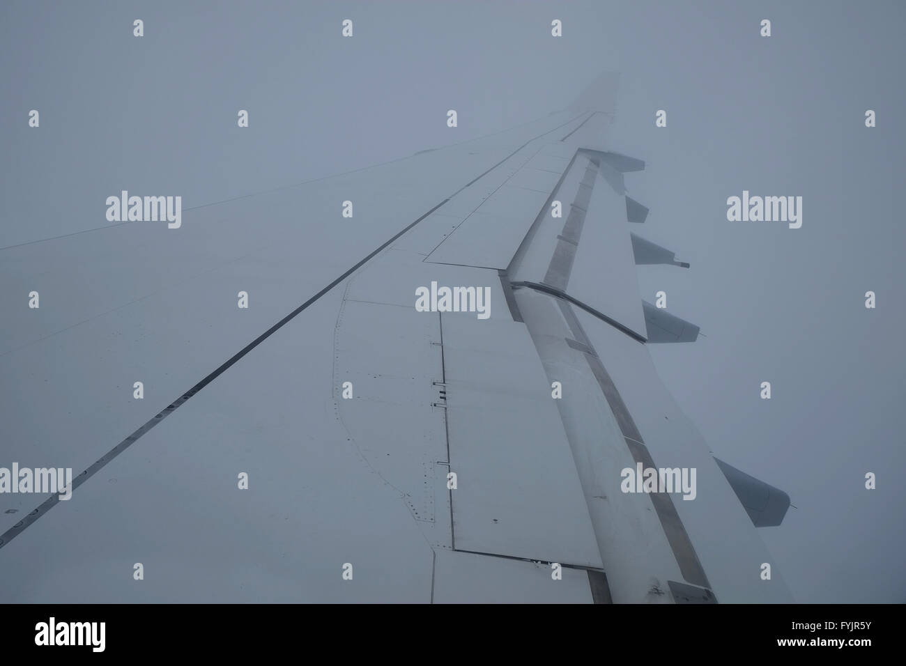 Aircraft wing in fog Stock Photo