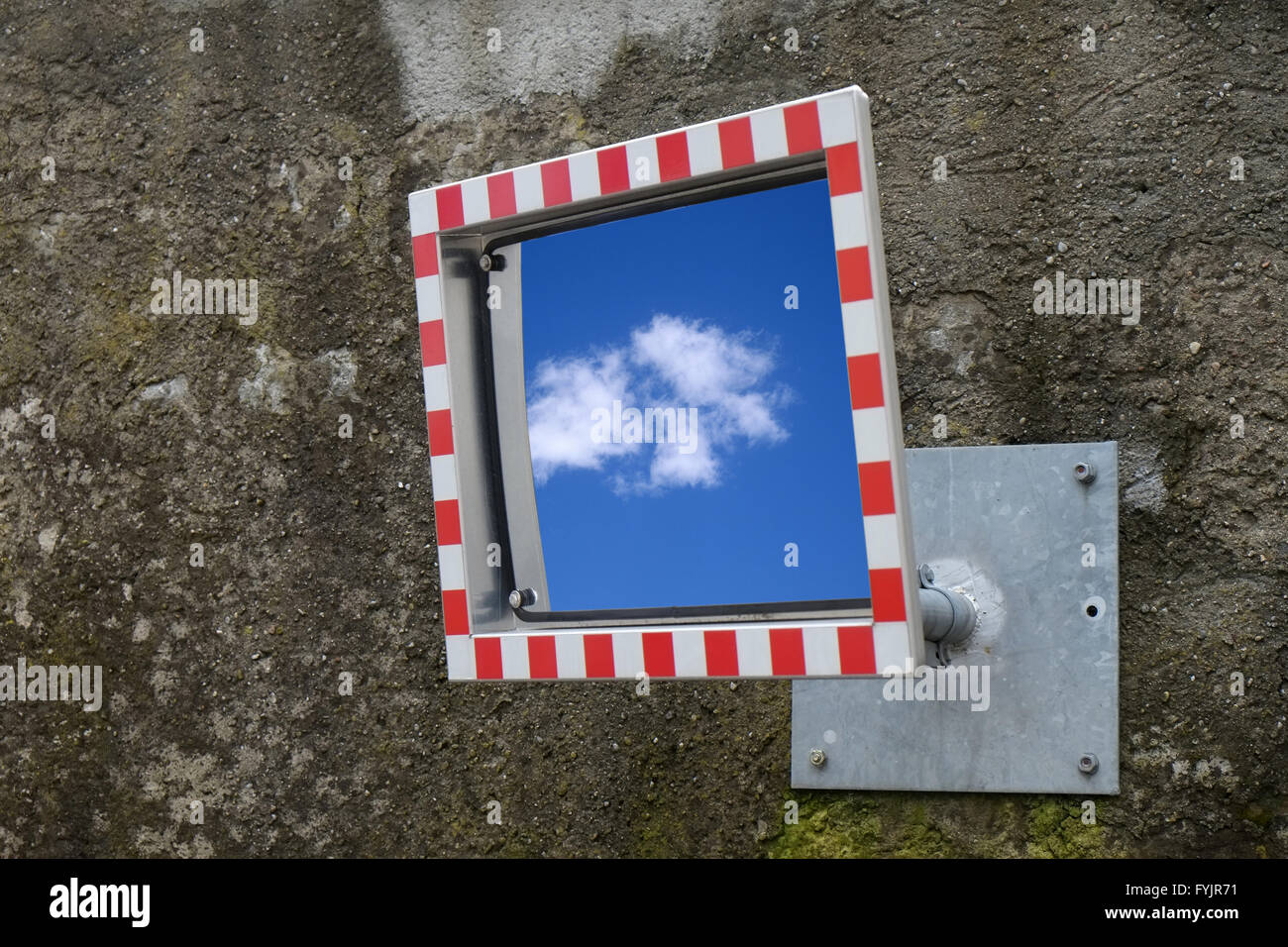 Traffic mirror with cloud refelection Stock Photo