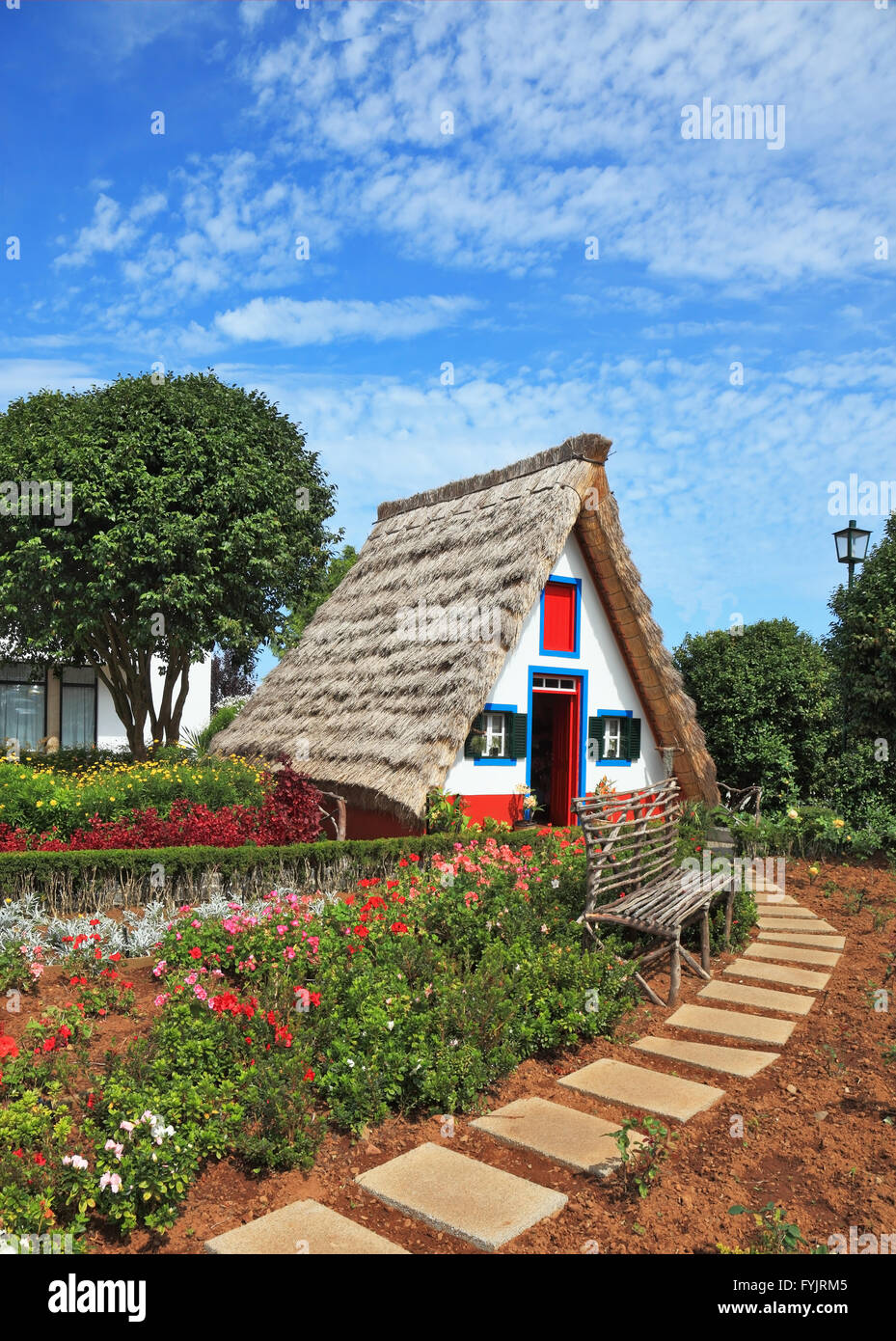 Charming cottage and small garden with flowers Stock Photo - Alamy