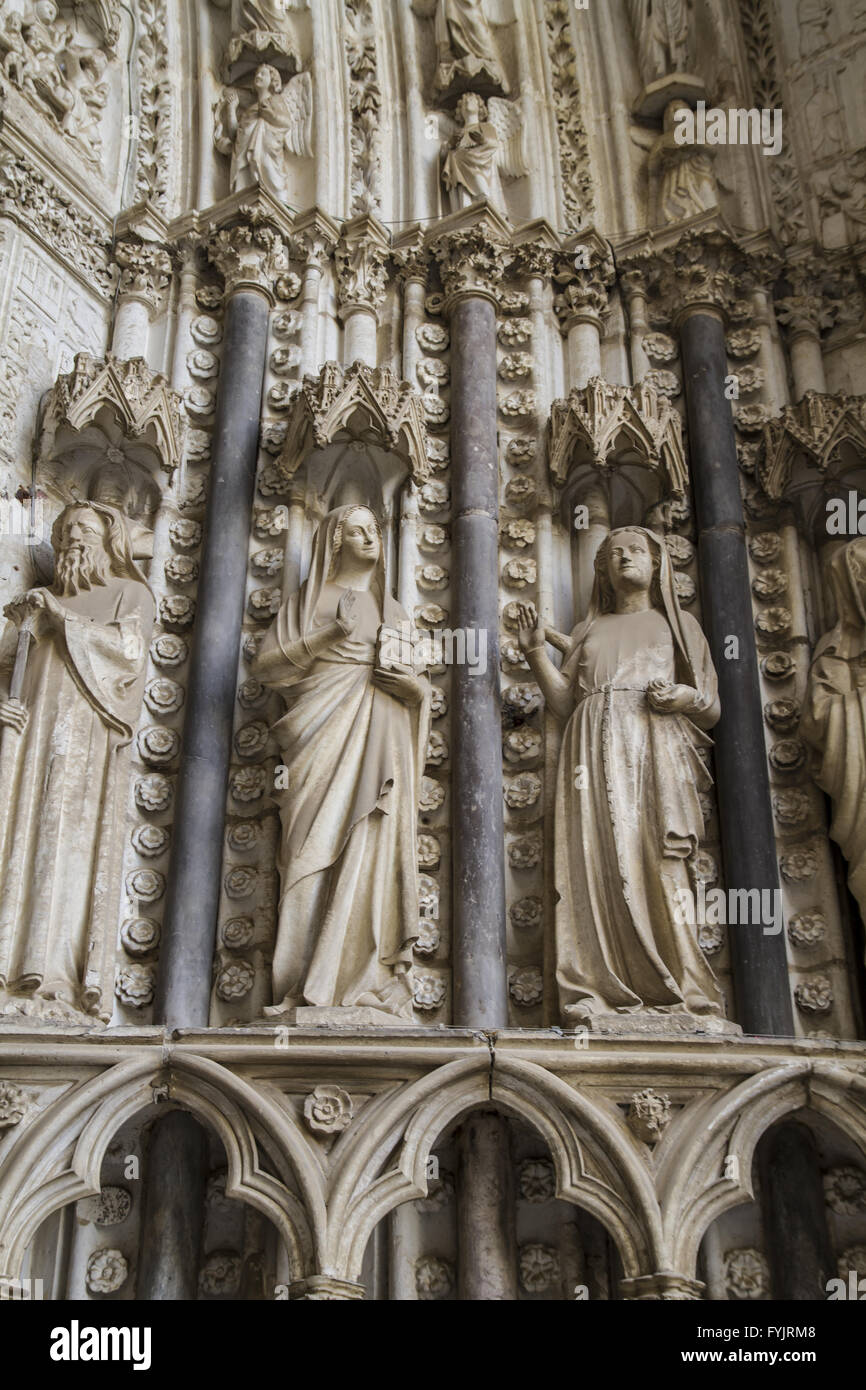 side entrance of the Cathedral of Toledo, arc with religious reliefs Stock Photo