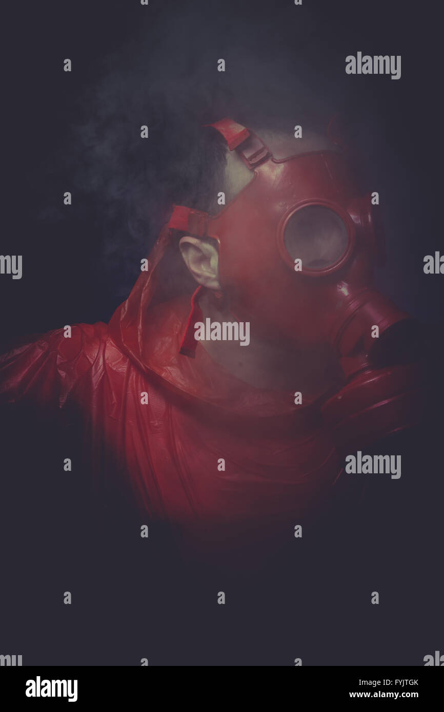 Destruction, A man in a gas mask over the smoke. black background and ...