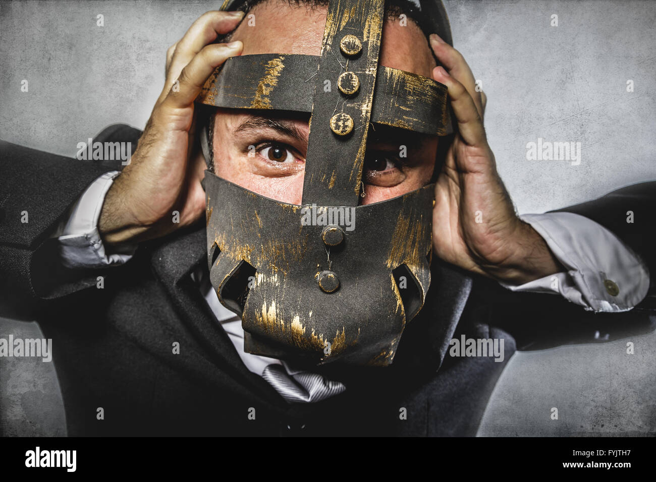 manager, dangerous business man with iron mask and expressions Stock Photo