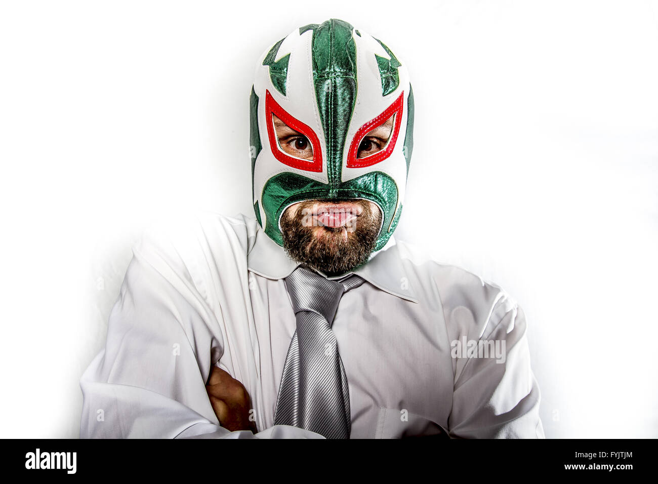 job, aggressive businessman with Mexican warrior mask Stock Photo