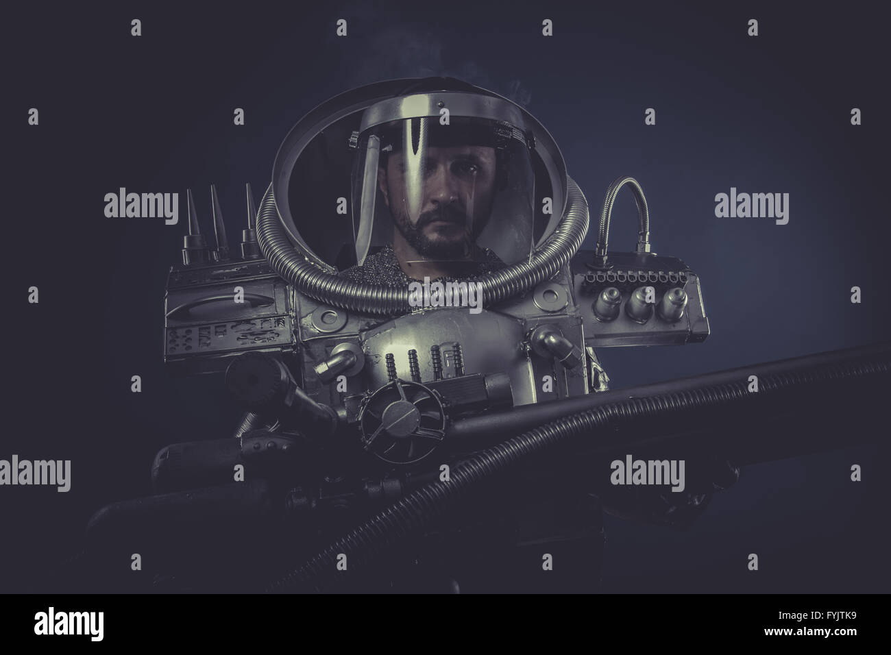 spaceman in silver armor and huge cannon Stock Photo - Alamy