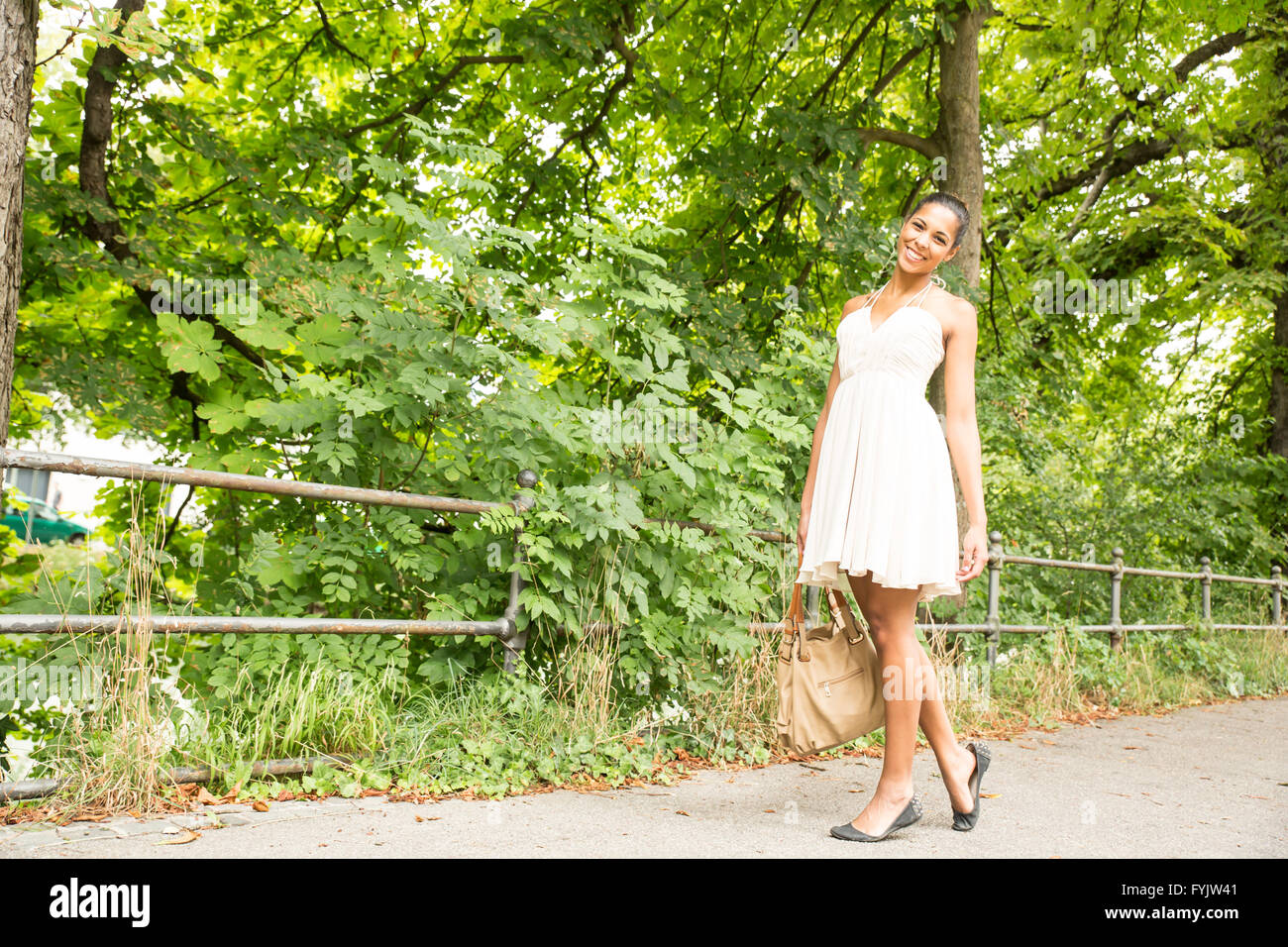 Young Girl walking in the park Stock Photo - Alamy
