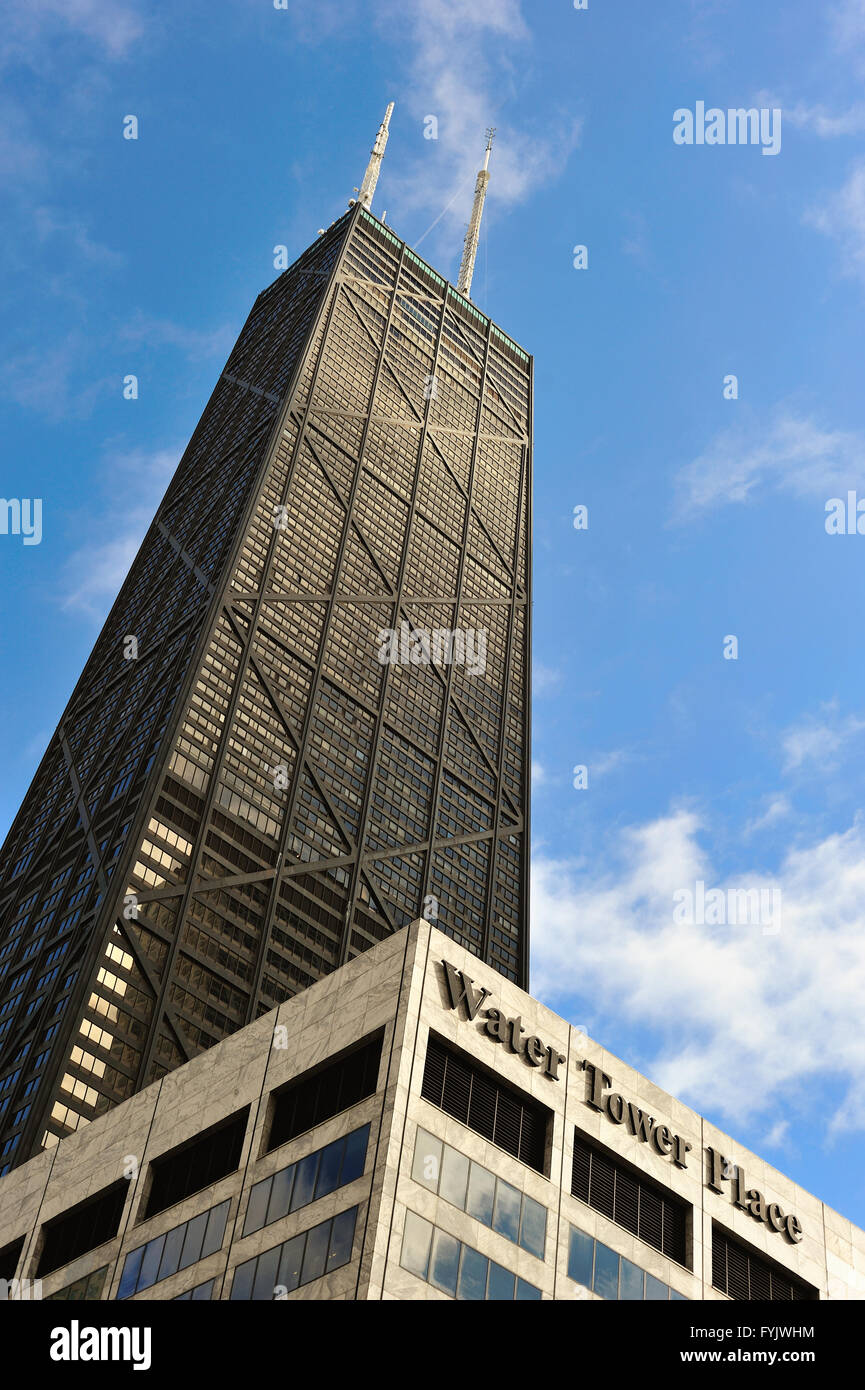 Chicago, Illinois, USA. The John Hancock Building towering over Water Tower Place along Michigan Avenue's Magnificent Mile. Stock Photo