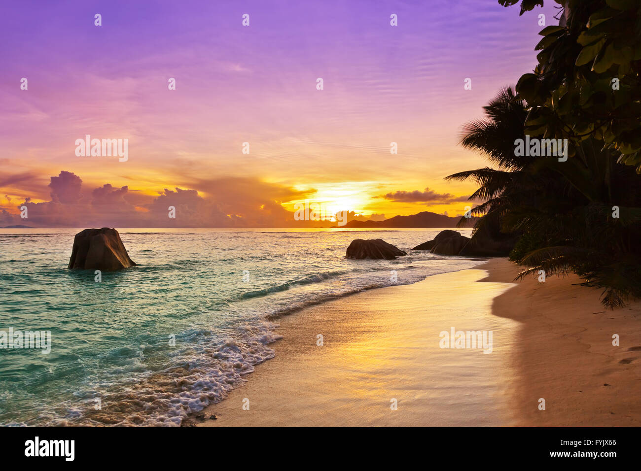 Sunset on beach Source D'Argent at Seychelles Stock Photo - Alamy
