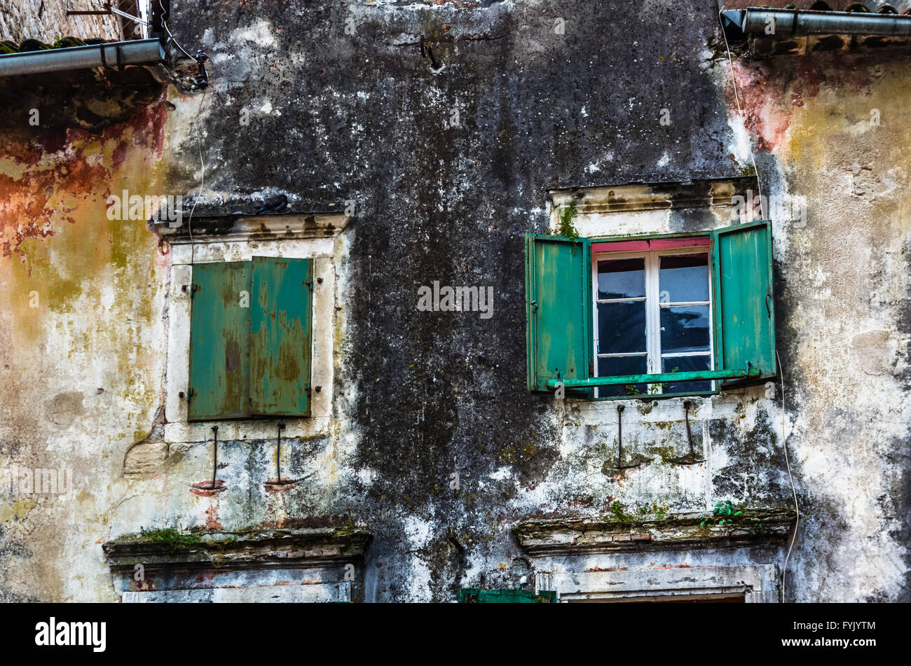 Window with louvers in old house Stock Photo