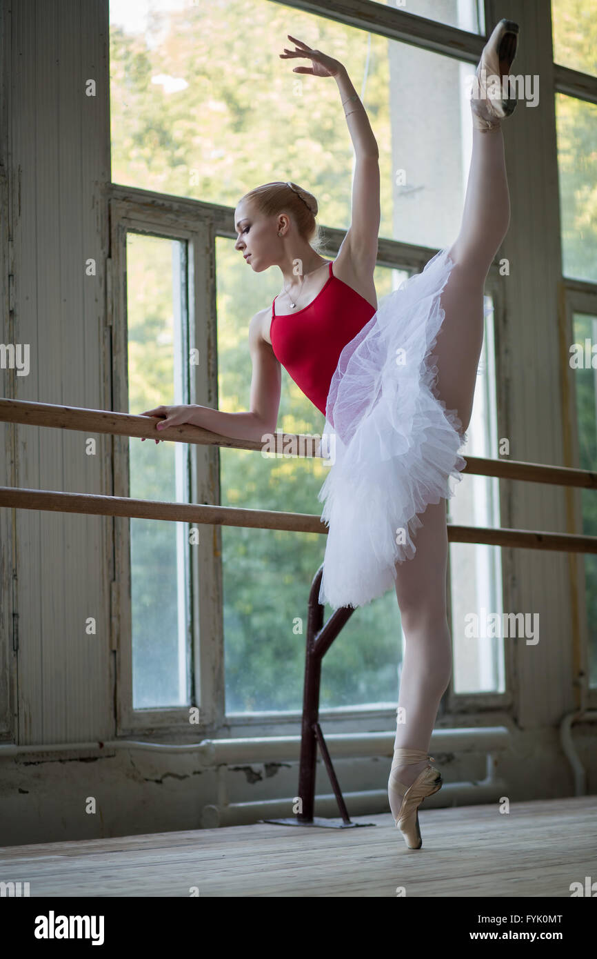 Young ballerina standing on one leg Stock Photo