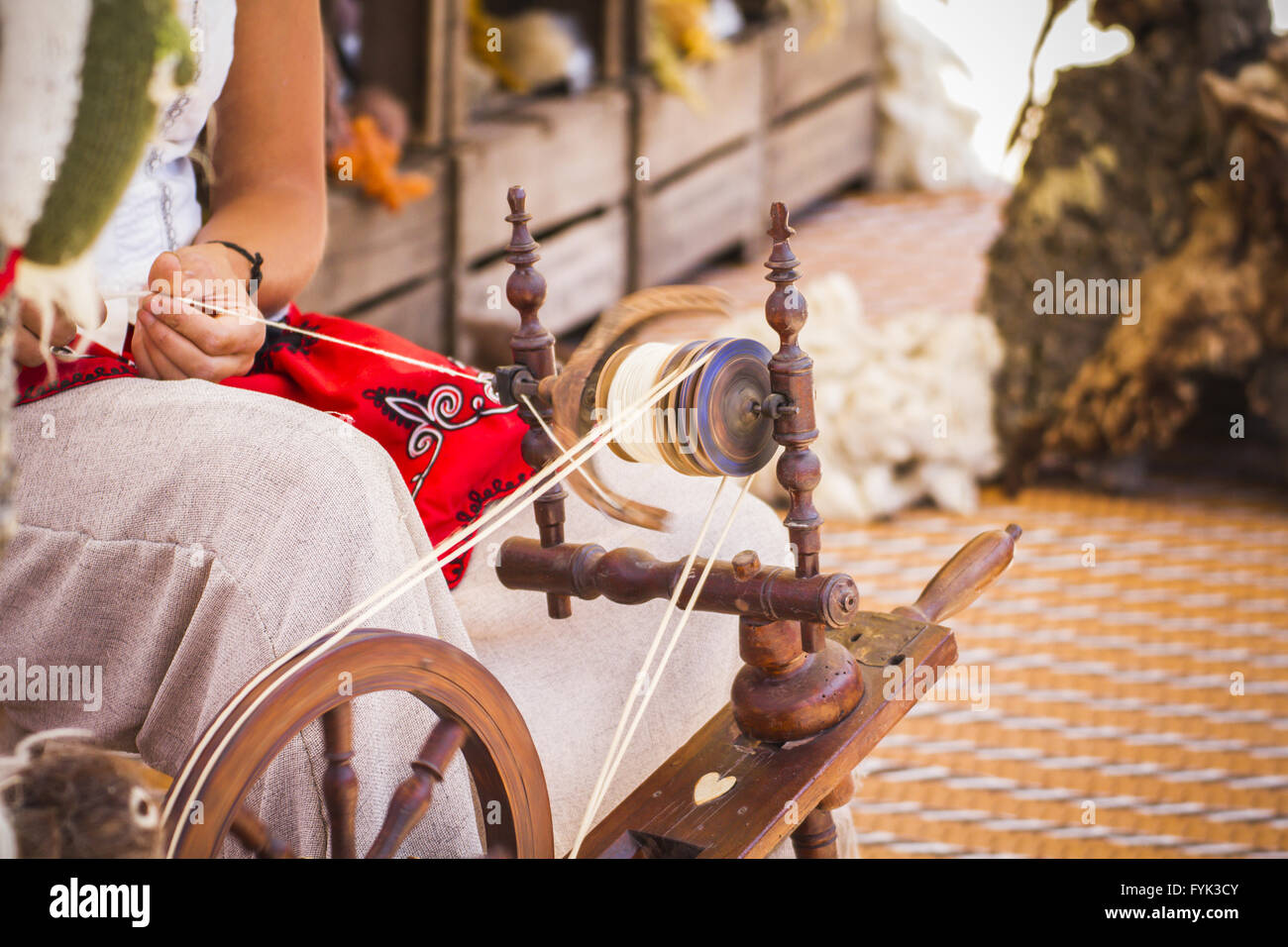 distaff, woman spinning yarn on an old spinning wheel Stock Photo Alamy