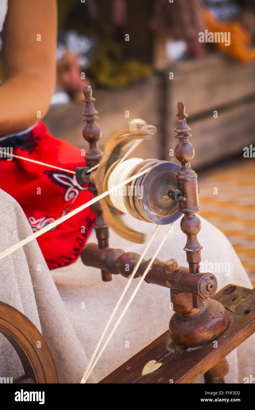 distaff, woman spinning yarn on an old spinning wheel Stock Photo Alamy