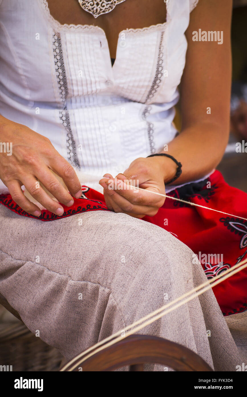 distaff, woman spinning yarn on an old spinning wheel Stock Photo Alamy