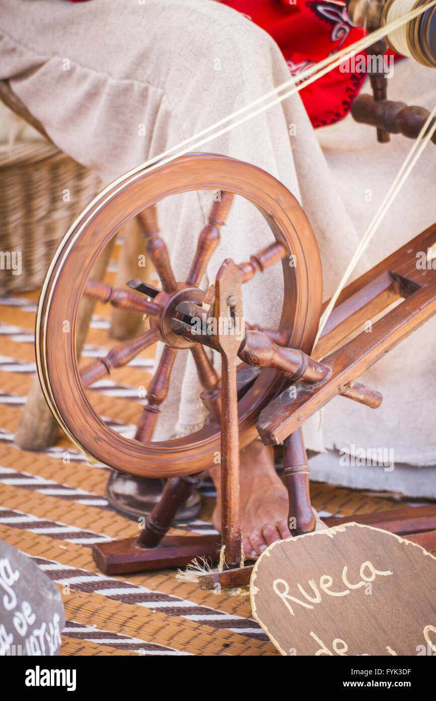 distaff, woman spinning yarn on an old spinning wheel Stock Photo Alamy