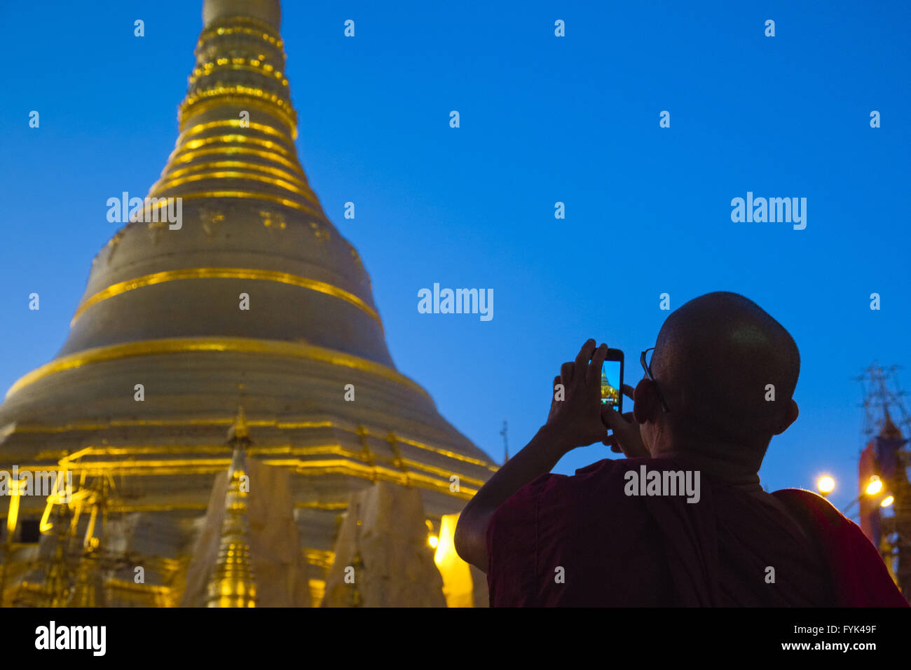 Monk at Shwedagon pagoda, Yangon, Myanmar, Asia Stock Photo