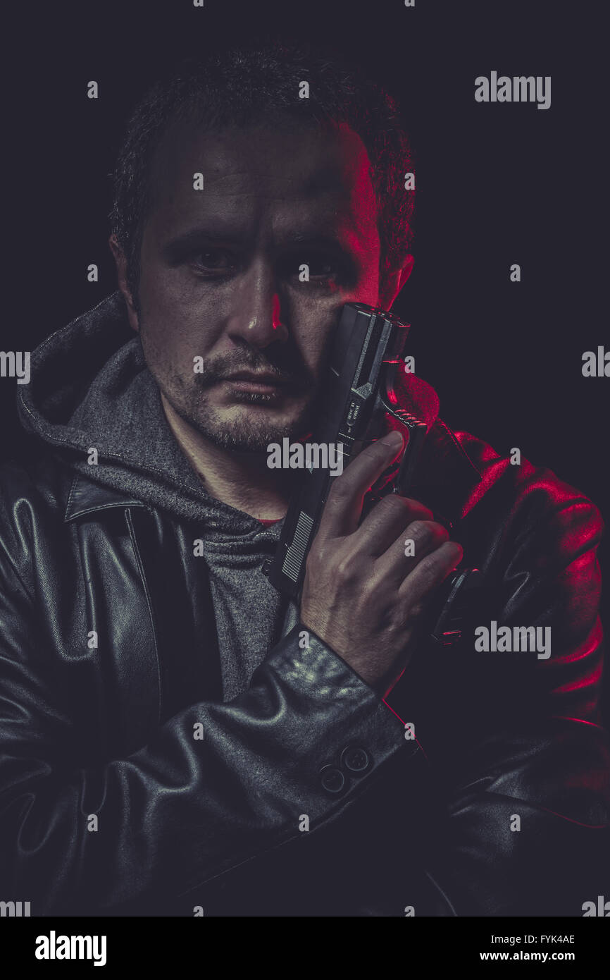 Weapon, secret agent with gun and red light Stock Photo