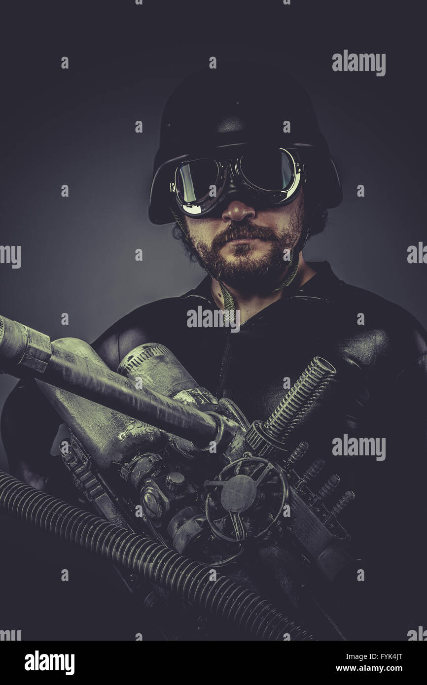 Robot.Starfighter with huge plasma rifle, fantasy concept, military helmet and goggles motorcyclist Stock Photo