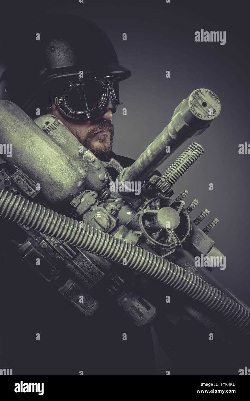 Army fiction, Future soldier with huge weapon, sci-fi scene Stock Photo
