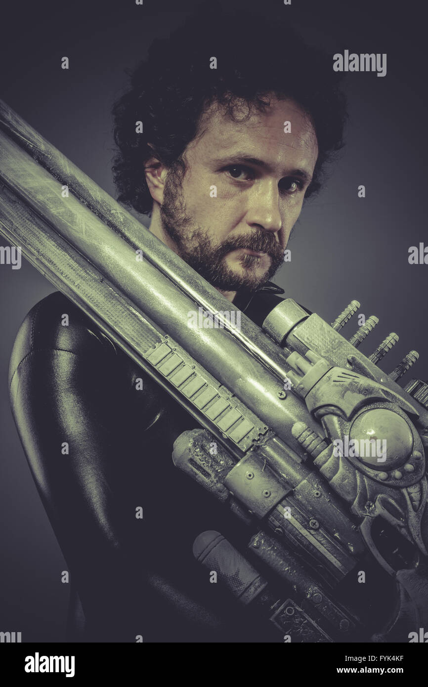 Warrior, Future soldier with huge weapon, sci-fi scene Stock Photo