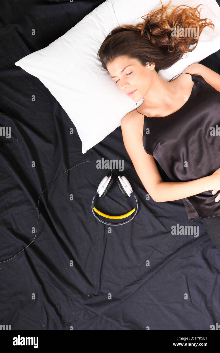 Young woman sleeping with headset Stock Photo Alamy