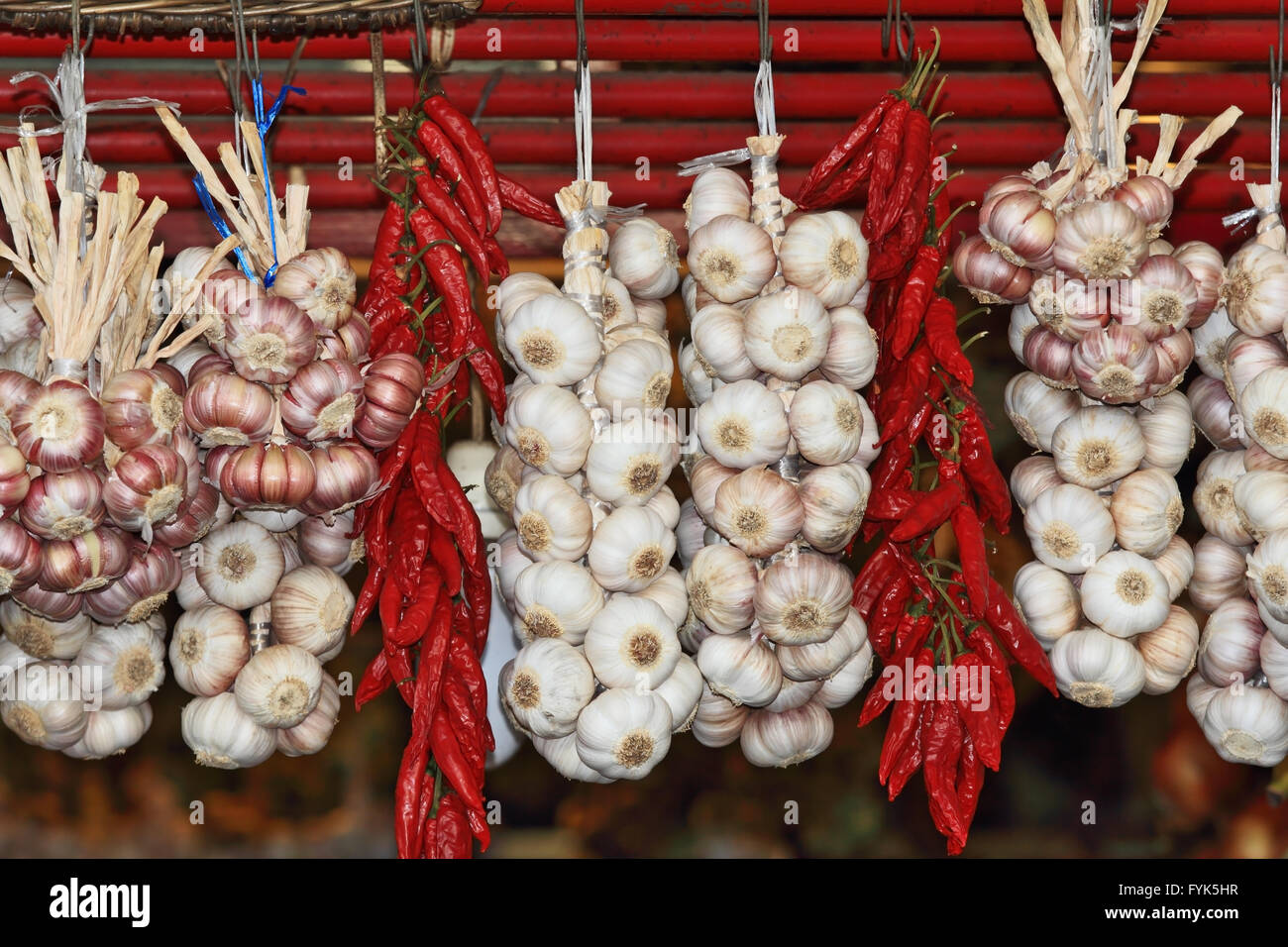 Bundles of garlic and bundles of cayenne pepper Stock Photo