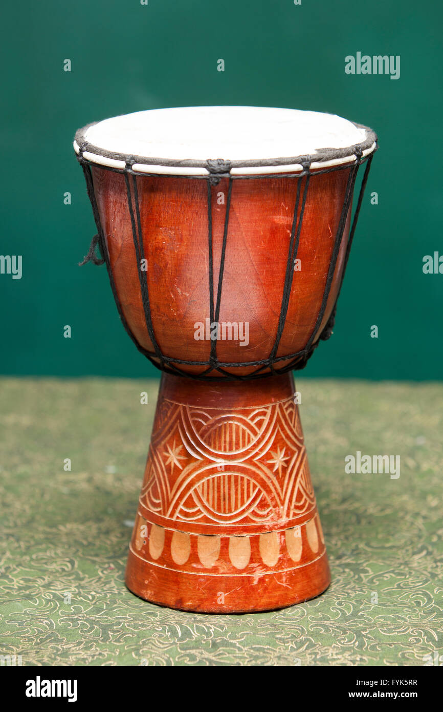 Brown Tribal Drum Isolated on a green background Stock Photo