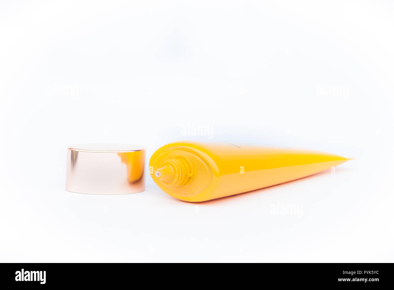 Tube container of sun cream on white background Stock Photo