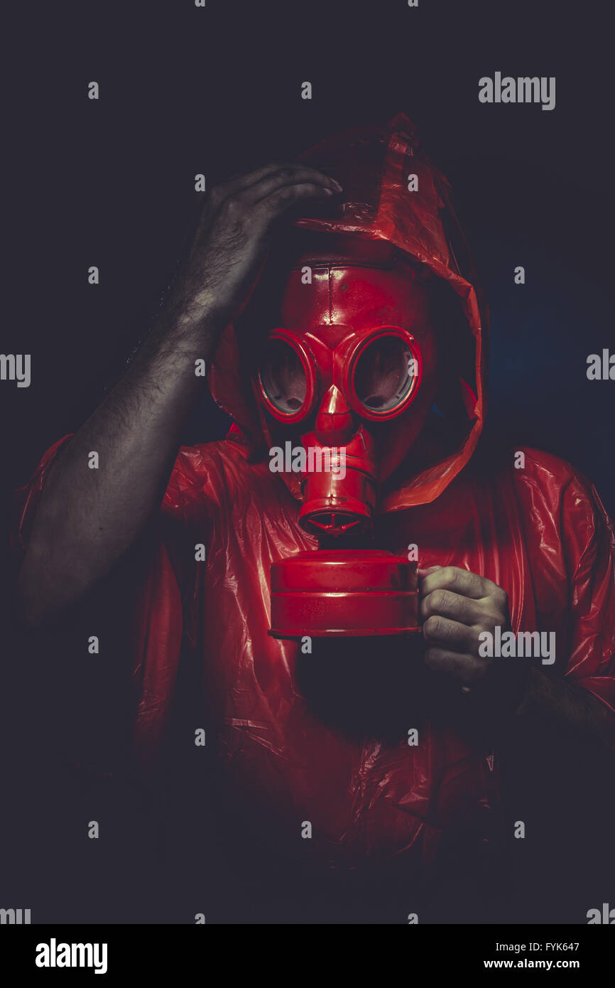 survival nuclear concept, man with red gas mask Stock Photo