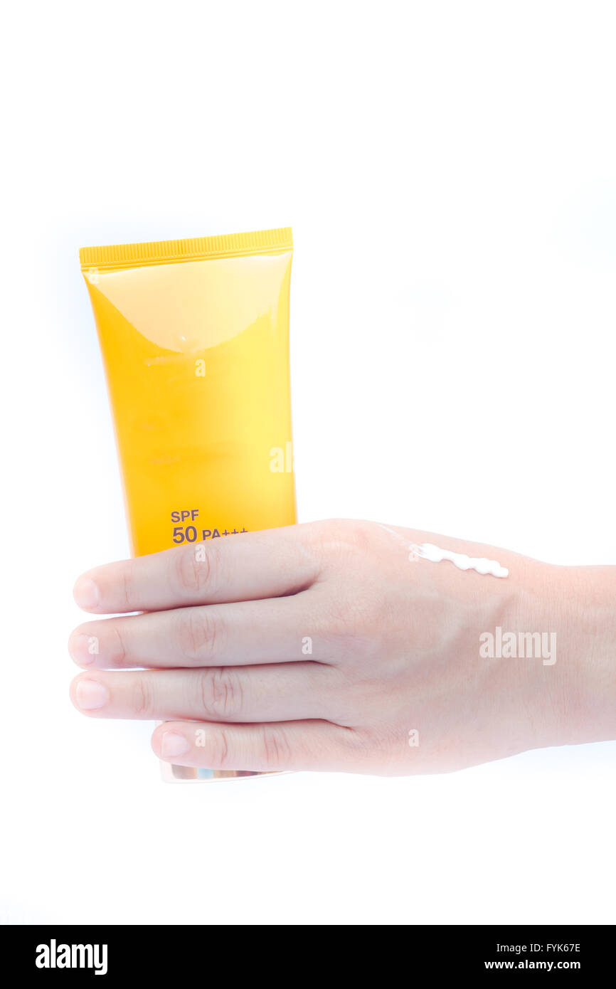 Woman pouring body lotion on hand on white background Stock Photo