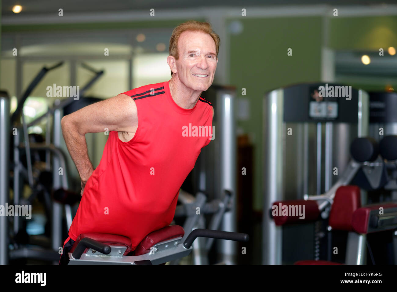 Senior citizen man working out at a gym Stock Photo