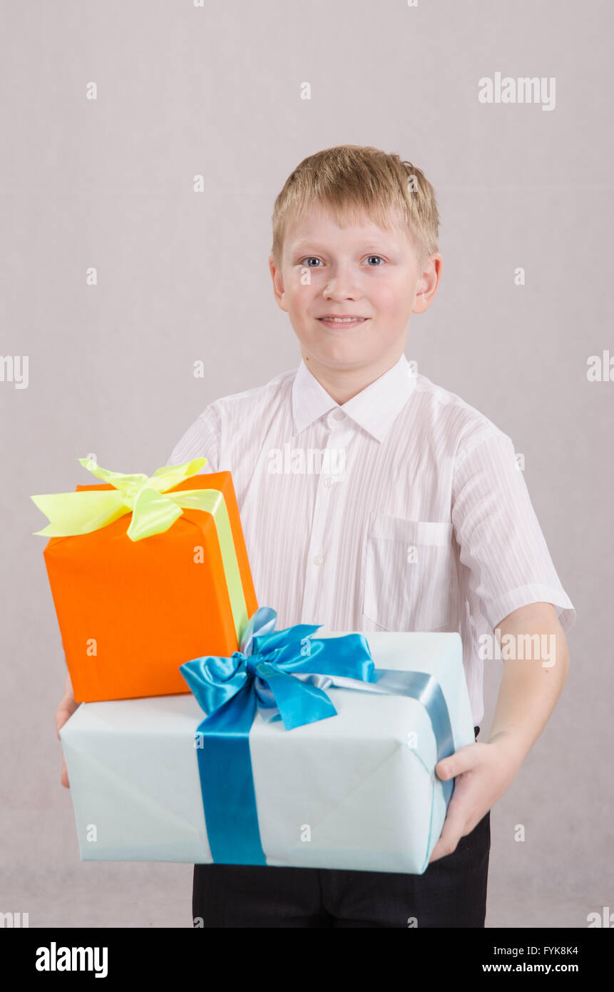 Portrait of teenage boy with gifts in their hands Stock Photo