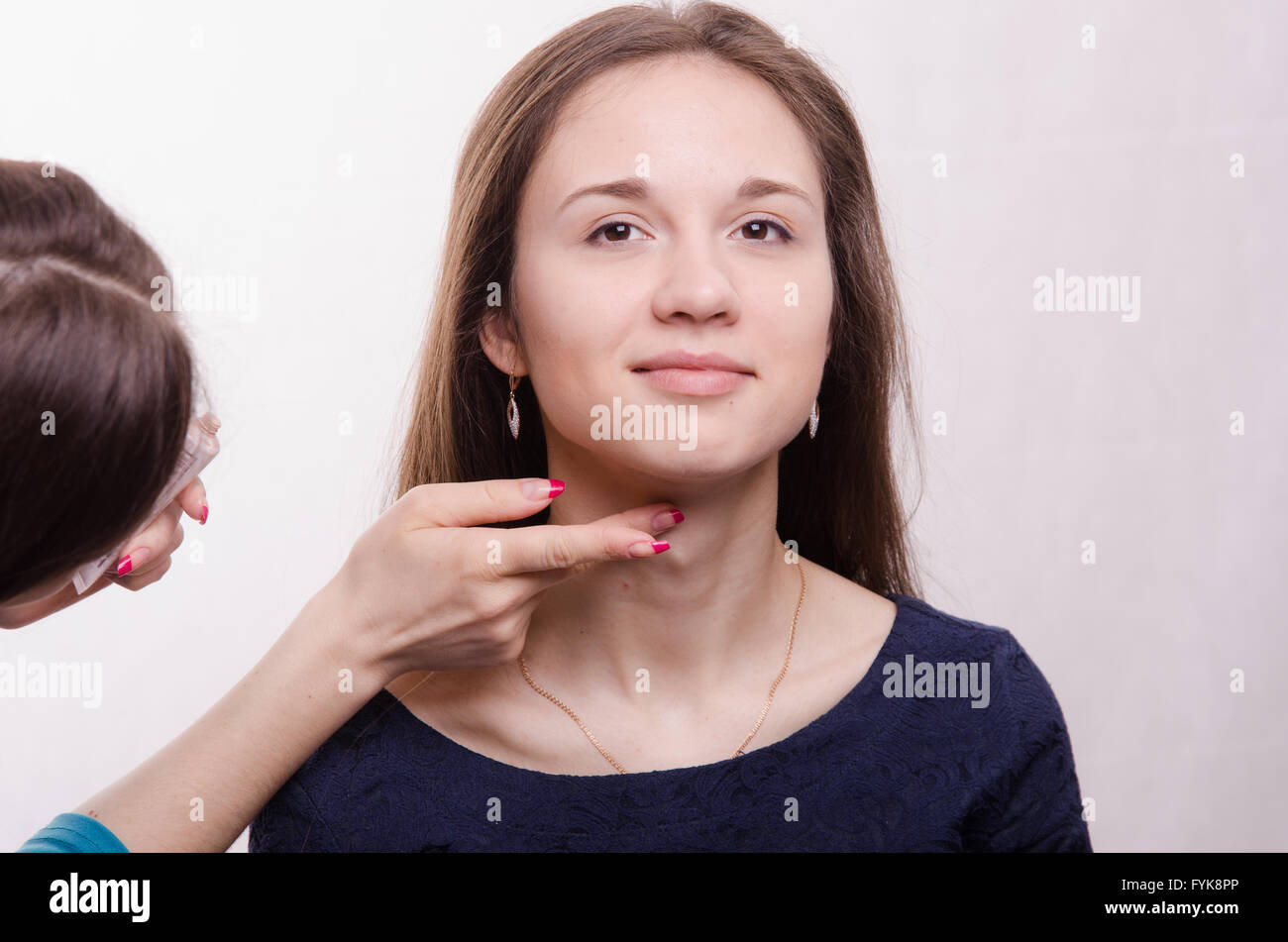 Beautiful model makeup artist applied concealer on neck Stock Photo Alamy