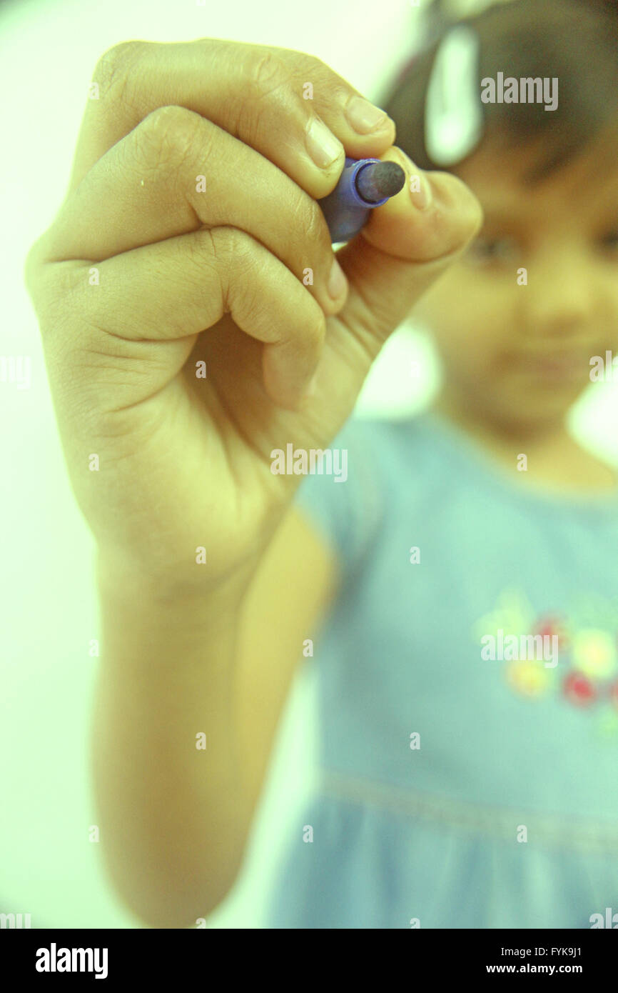 Girl hand holding pen writing hi-res stock photography and images - Alamy