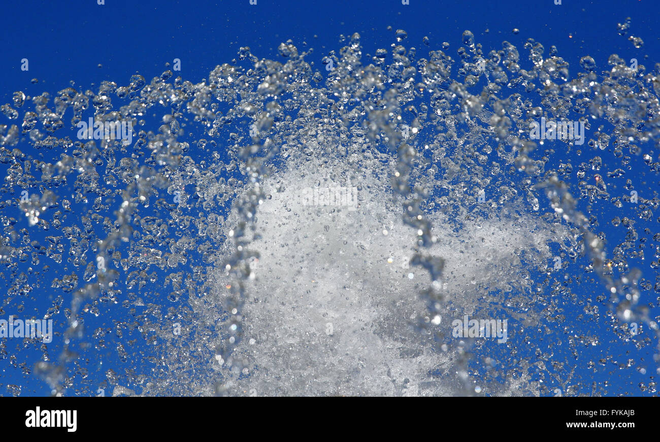 Fountain drops of pure water against a blue sky Stock Photo - Alamy