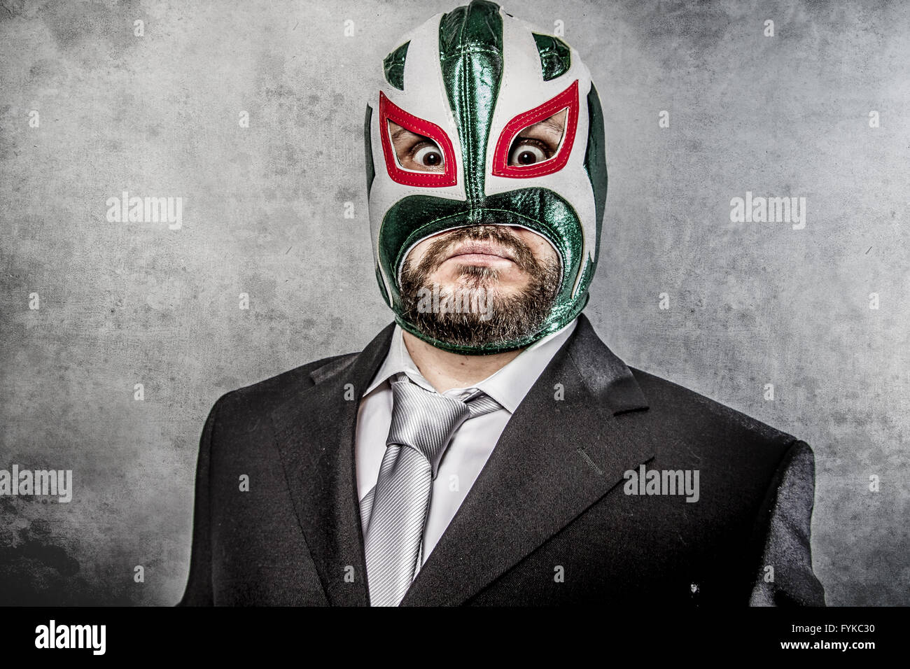 businessman angry with Mexican wrestler mask Stock Photo
