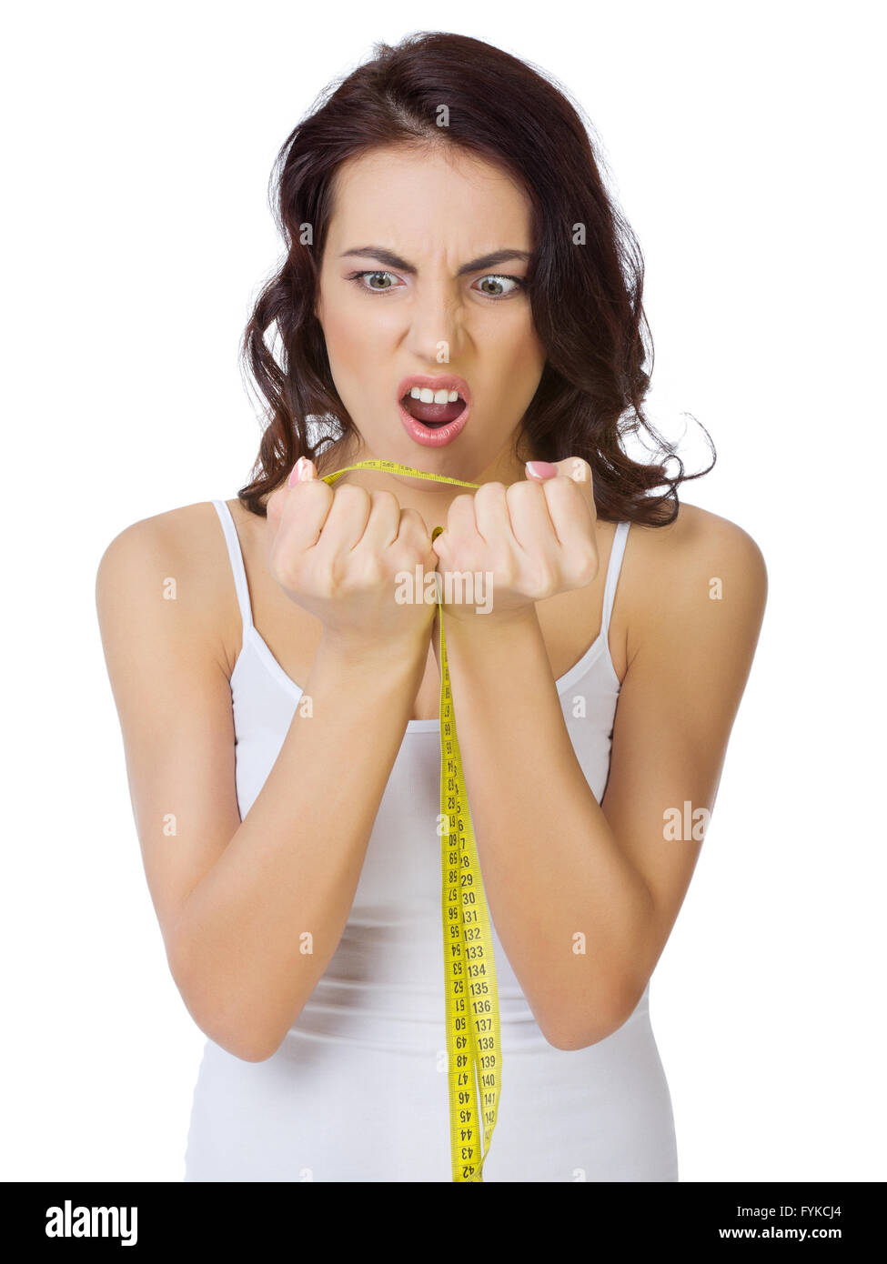 Displeased girl with measurement tape isolated Stock Photo