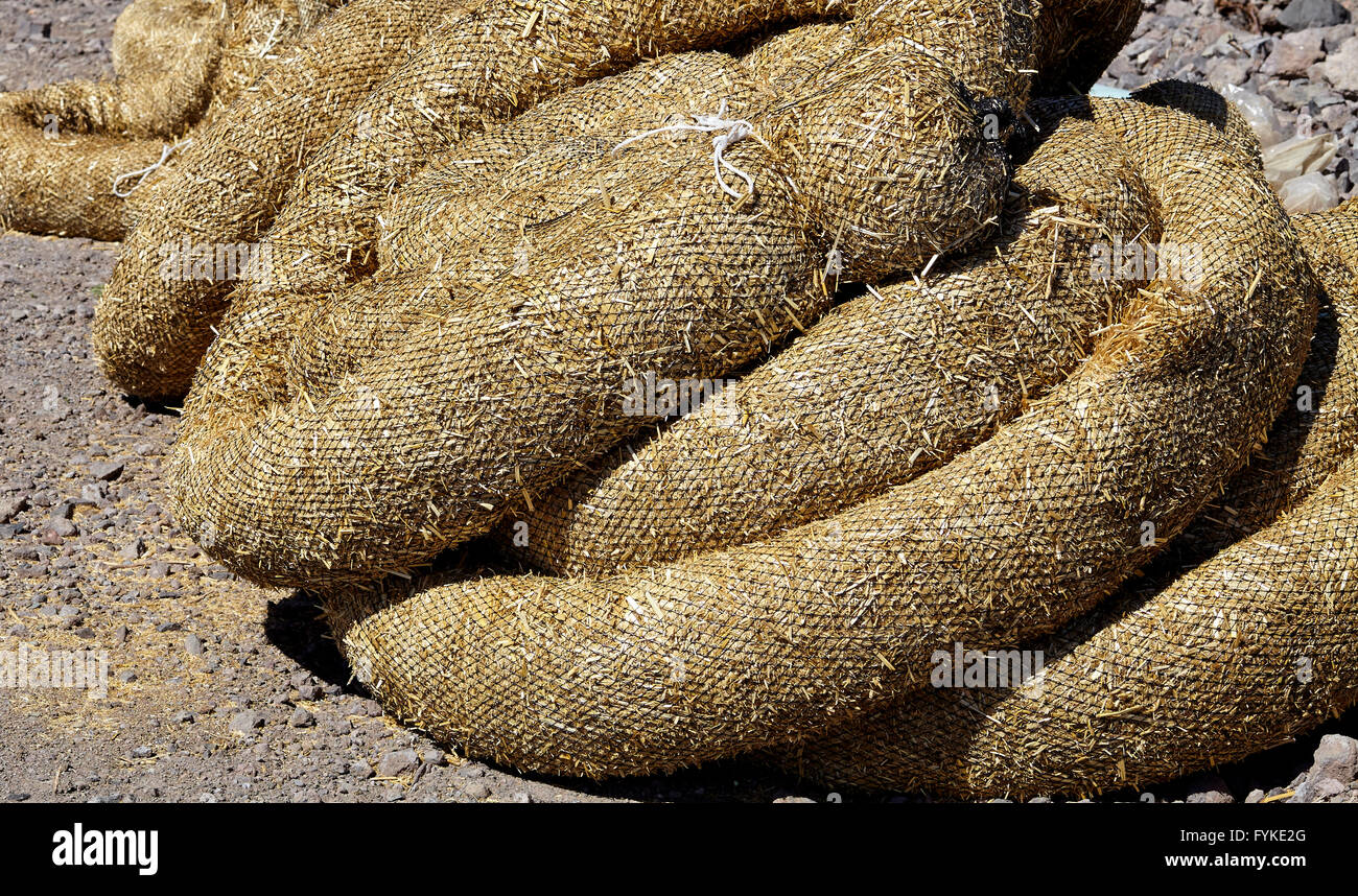 Construction erosion pollution control straw wattles industry closeup Stock Photo