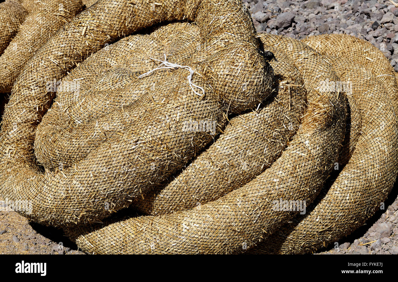 Construction erosion pollution control straw wattles industry detail Stock Photo